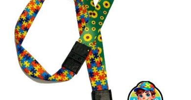 Cordão Dupla Face Autismo e Girassol com trava anti-sufocamento e porta-crachá, usado para identificar deficiências ocultas como TEA e TDAH.
